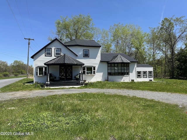 111 Rose St, Delanson, NY 12053 - view of front facade featuring a porch, metal roof, and a front yard