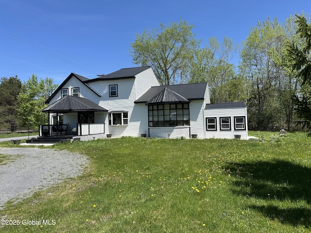 111 Rose St, Delanson, NY 12053 - rear view of property with a lawn, covered porch, and metal roof