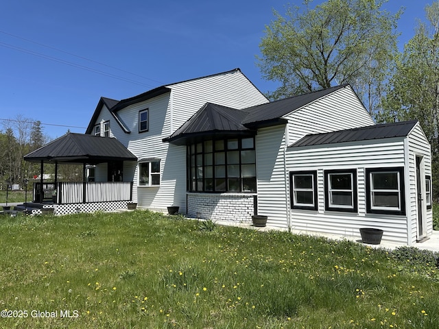 111 Rose St, Delanson, NY 12053 - back of property featuring a lawn, a gazebo, and metal roof