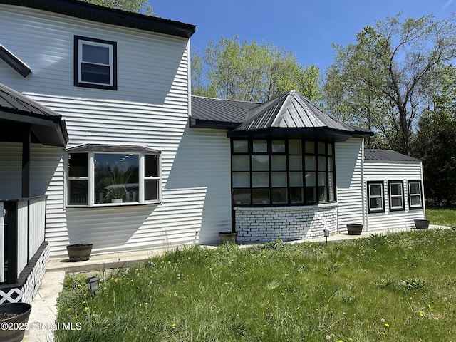 111 Rose St, Delanson, NY 12053 - rear view of house featuring metal roof and a lawn