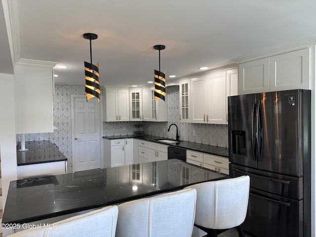 111 Rose St, Delanson, NY 12053 - kitchen featuring black appliances, a sink, tasteful backsplash, glass insert cabinets, and white cabinetry