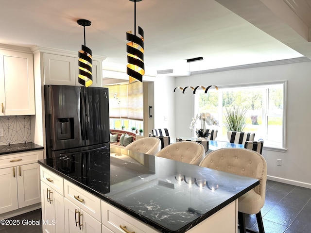 111 Rose St, Delanson, NY 12053 - kitchen with stainless steel fridge, a center island, baseboards, white cabinets, and pendant lighting