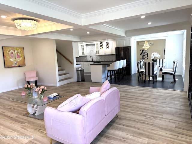 111 Rose St, Delanson, NY 12053 - living area featuring a chandelier, stairs, ornamental molding, recessed lighting, and light wood-style flooring