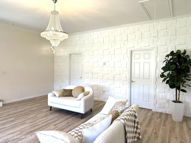 111 Rose St, Delanson, NY 12053 - living room featuring attic access, light wood-style flooring, crown molding, baseboards, and a chandelier