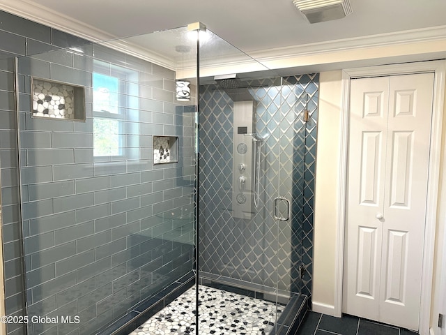 111 Rose St, Delanson, NY 12053 - bathroom with a stall shower, ornamental molding, and tile patterned floors