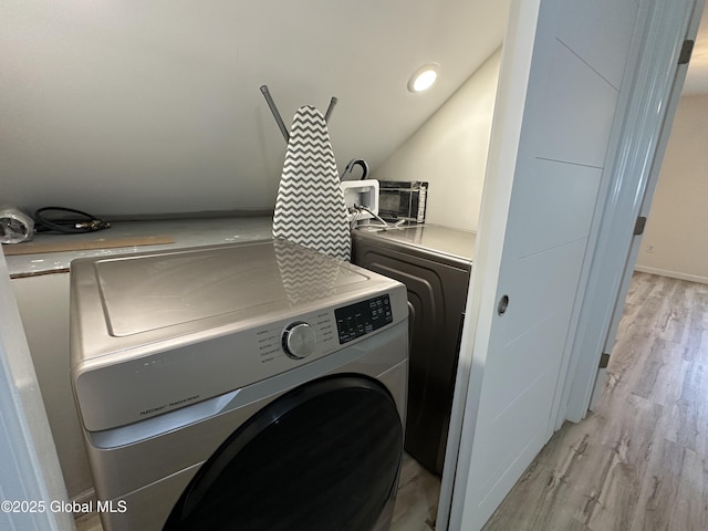 111 Rose St, Delanson, NY 12053 - washroom with separate washer and dryer and light wood-style flooring