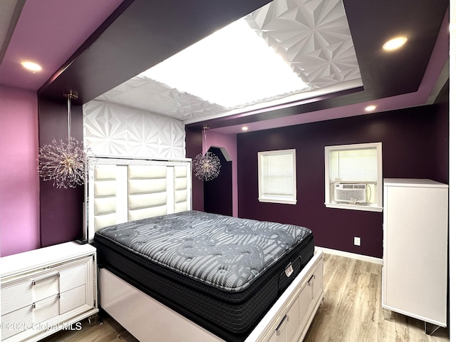 111 Rose St, Delanson, NY 12053 - bedroom featuring cooling unit, a raised ceiling, wood finished floors, baseboards, and recessed lighting