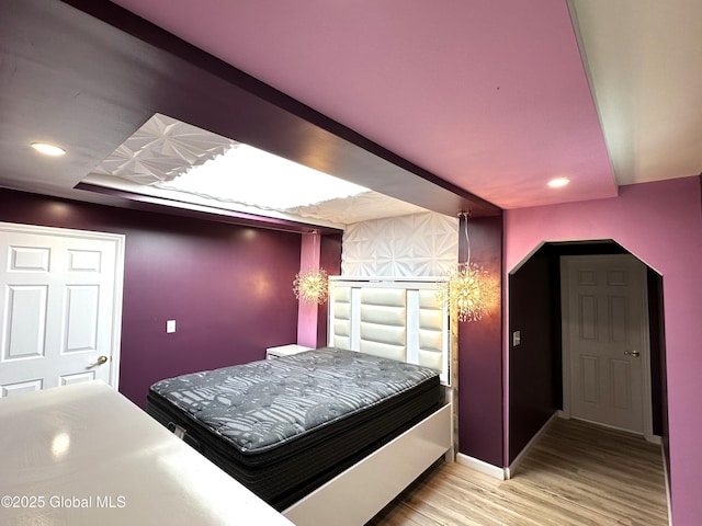 111 Rose St, Delanson, NY 12053 - bedroom featuring wood finished floors, recessed lighting, arched walkways, and baseboards