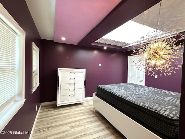 111 Rose St, Delanson, NY 12053 - bedroom featuring wood finished floors, baseboards, recessed lighting, and a chandelier