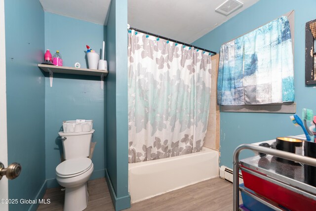 177 County Highway 155, Mayfield, NY 12025 - full bath featuring wood finished floors, toilet, shower / tub combo with curtain, and baseboard heating