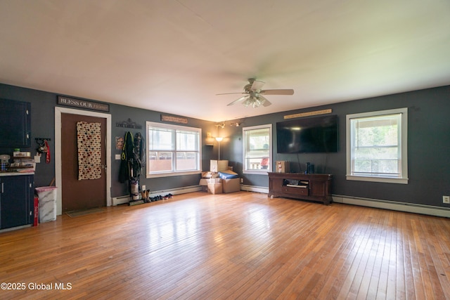 177 County Highway 155, Mayfield, NY 12025 - living room with baseboard heating, ceiling fan, and hardwood / wood-style floors