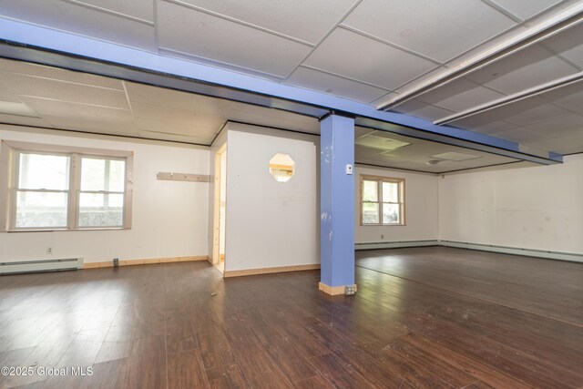 177 County Highway 155, Mayfield, NY 12025 - basement with hardwood / wood-style floors, a baseboard heating unit, baseboards, and a paneled ceiling