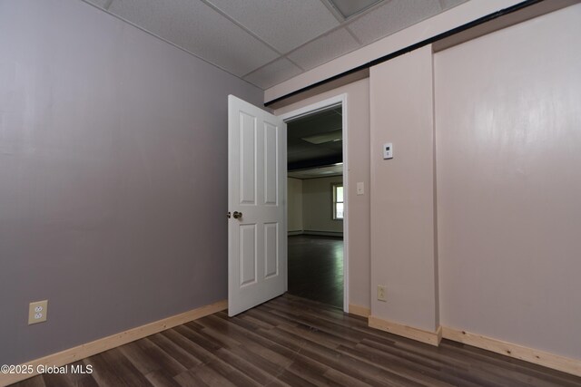 177 County Highway 155, Mayfield, NY 12025 - unfurnished room with dark wood-style flooring, baseboards, and a paneled ceiling
