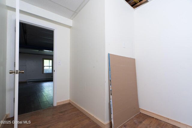 177 County Highway 155, Mayfield, NY 12025 - hallway featuring wood finished floors, a baseboard radiator, and baseboards