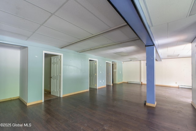 177 County Highway 155, Mayfield, NY 12025 - below grade area with hardwood / wood-style floors, baseboard heating, a drop ceiling, a baseboard heating unit, and baseboards
