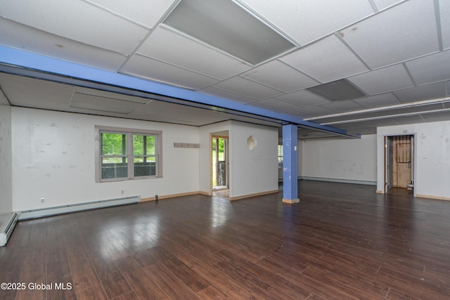 177 County Highway 155, Mayfield, NY 12025 - basement with wood finished floors, a baseboard heating unit, a drop ceiling, and baseboards