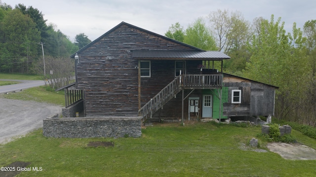 177 County Highway 155, Mayfield, NY 12025 - rear view of property featuring stairway, a lawn, and a wooden deck