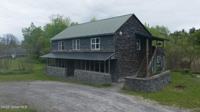 177 County Highway 155, Mayfield, NY 12025 - view of front of house with metal roof, a front lawn, stairway, and stone siding