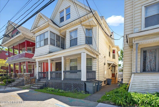 view of property featuring covered porch