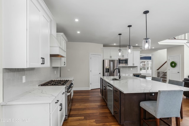 kitchen featuring appliances with stainless steel finishes, recessed lighting, dark wood-style flooring, white cabinets, and baseboards