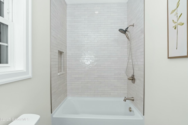 bathroom with toilet and shower / bathtub combination