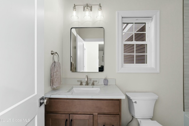full bath featuring toilet and vanity