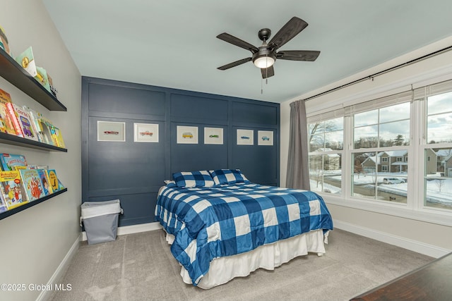 bedroom featuring baseboards, carpet, and a ceiling fan