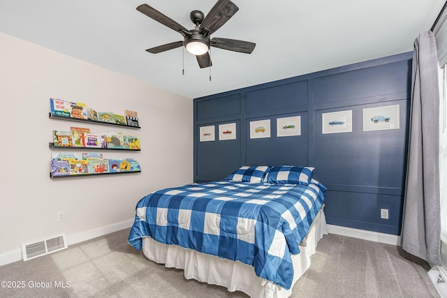 bedroom with carpet floors, baseboards, and a ceiling fan