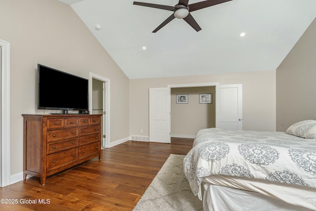 bedroom with lofted ceiling, wood finished floors, baseboards, recessed lighting, and a ceiling fan