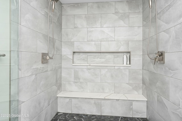 full bath with tiled shower