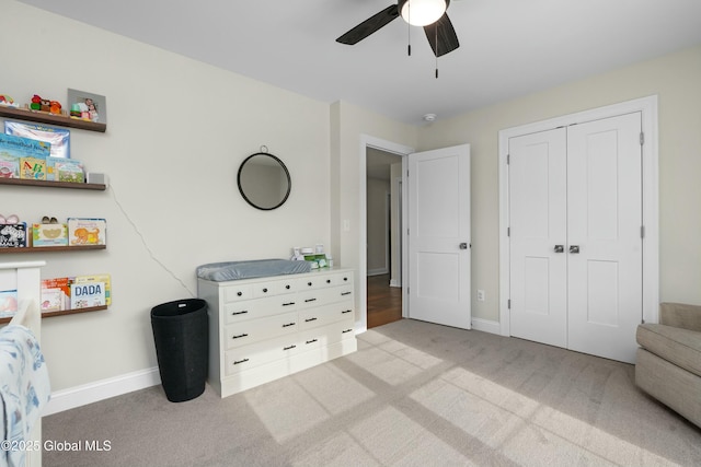 bedroom featuring baseboards, carpet floors, and a closet