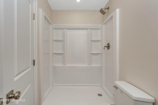 full bath featuring a shower stall, toilet, and recessed lighting