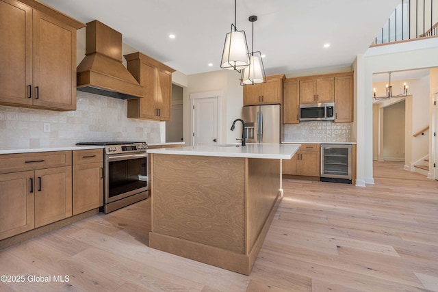 kitchen featuring appliances with stainless steel finishes, beverage cooler, custom exhaust hood, tasteful backsplash, and light countertops