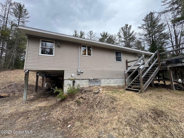 11 Beaureguard Way, Minerva, NY 12851 - back of property with stairs and a wooden deck