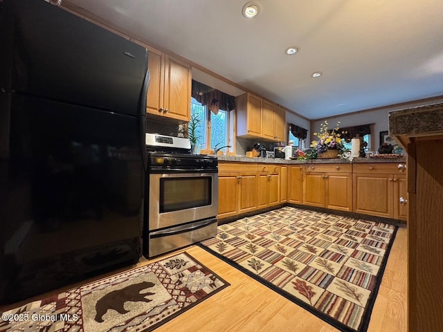 11 Beaureguard Way, Minerva, NY 12851 - kitchen featuring stainless steel range with gas cooktop, freestanding refrigerator, recessed lighting, and light wood finished floors