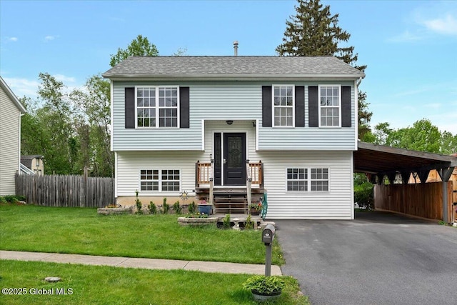 16 Morgans Run, Schuylerville, NY 12871 - bi-level home featuring asphalt driveway and an attached carport
