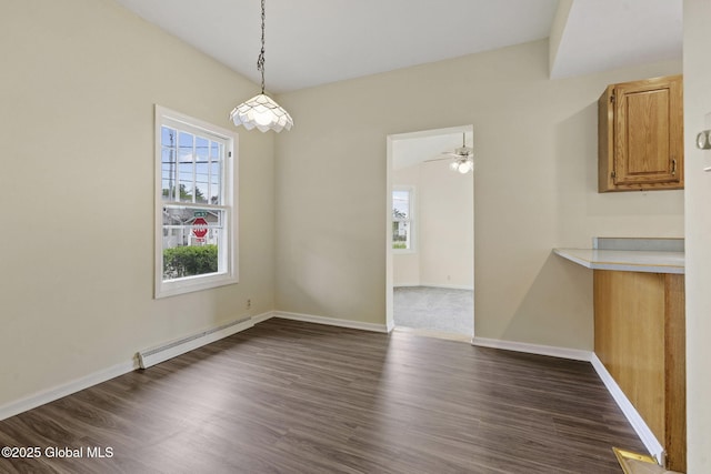 101 N Toll St, Scotia, NY 12302 - unfurnished dining area featuring a baseboard heating unit, dark wood finished floors, and baseboards