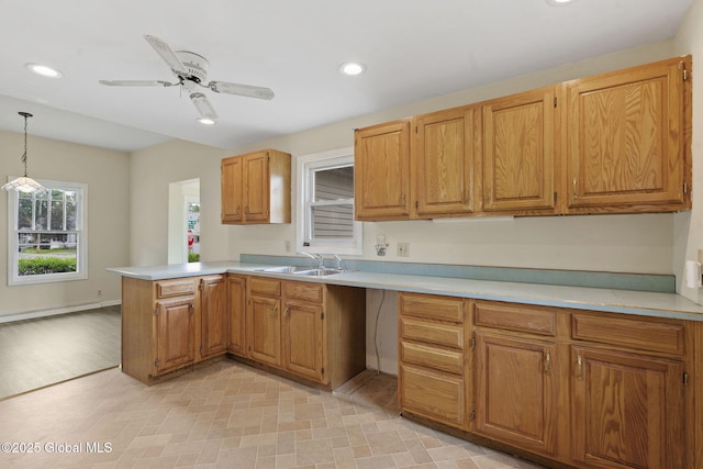 101 N Toll St, Scotia, NY 12302 - kitchen with a sink, a peninsula, light countertops, recessed lighting, and hanging light fixtures
