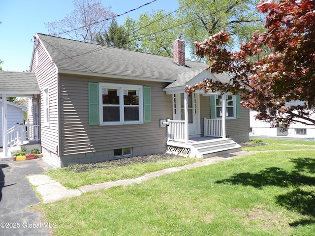 1005 9th Ave, Troy, NY 12182 - bungalow-style home featuring a shingled roof, a chimney, a front lawn, and a porch
