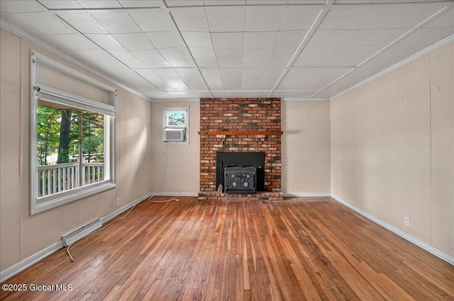 204 Greenfield Ave, Milton, NY 12020 - unfurnished living room with hardwood / wood-style floors, a wood stove, baseboard heating, crown molding, and baseboards
