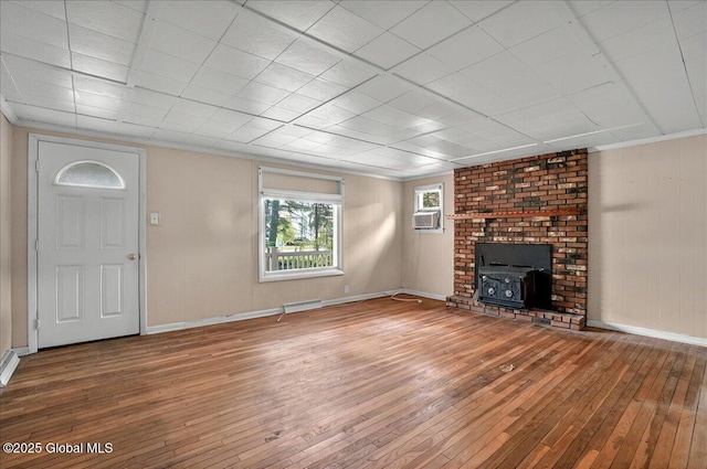 204 Greenfield Ave, Milton, NY 12020 - unfurnished living room with wood-type flooring, baseboards, a wood stove, ornamental molding, and cooling unit