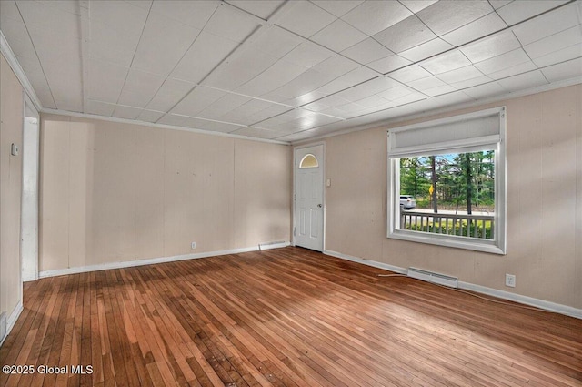 204 Greenfield Ave, Milton, NY 12020 - unfurnished room with wood-type flooring, a baseboard heating unit, baseboards, and ornamental molding