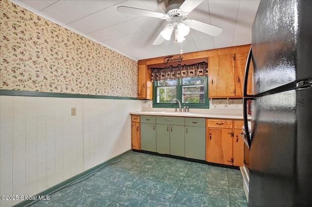204 Greenfield Ave, Milton, NY 12020 - kitchen with freestanding refrigerator, wallpapered walls, a sink, light countertops, and dark floors