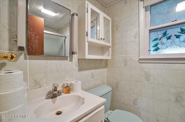204 Greenfield Ave, Milton, NY 12020 - bathroom with a shower stall, toilet, vanity, and tile walls