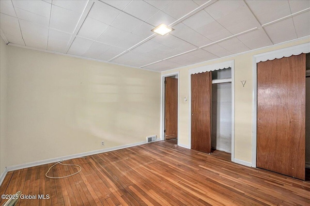 204 Greenfield Ave, Milton, NY 12020 - unfurnished bedroom featuring wood-type flooring, multiple closets, and baseboards