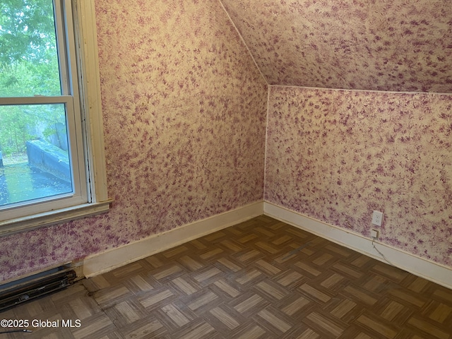 20 Henry St, Schenectady, NY 12304 - additional living space with baseboards, wallpapered walls, and vaulted ceiling