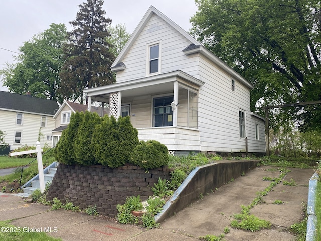 20 Henry St, Schenectady, NY 12304 - shotgun-style home featuring covered porch