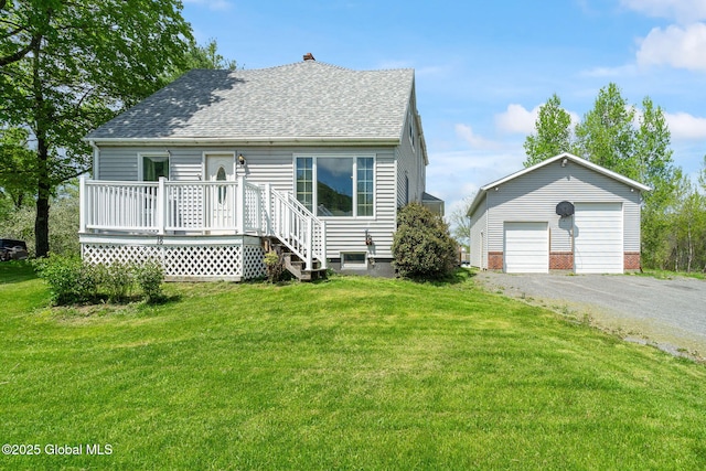 18 Main St, Berne, NY 12059 - view of front of home with a shingled roof, an outdoor structure, a garage, a front lawn, and a chimney