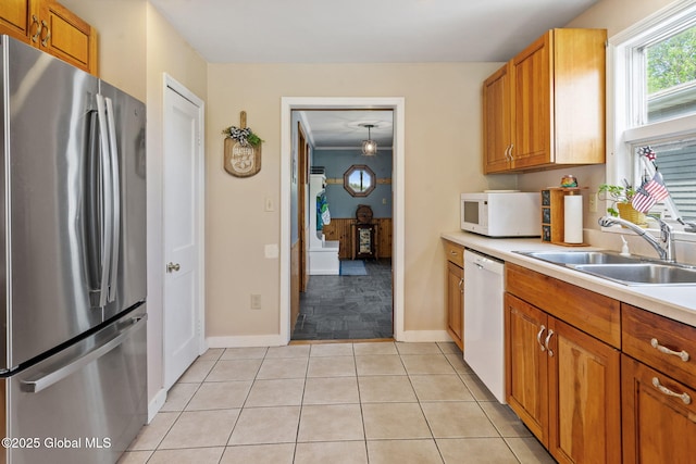18 Main St, Berne, NY 12059 - kitchen featuring white appliances, a sink, light countertops, and brown cabinetry