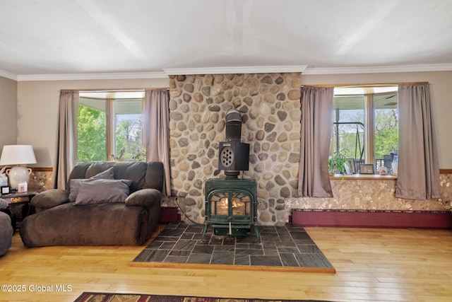 18 Main St, Berne, NY 12059 - living area with a wood stove, hardwood / wood-style floors, healthy amount of natural light, and crown molding